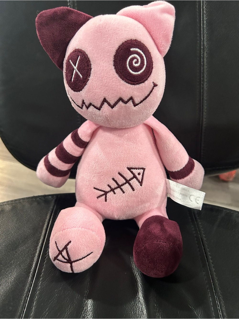 This is a Bilibang Gothic Style Pink Cat Plush toy featuring a stitched fish ske